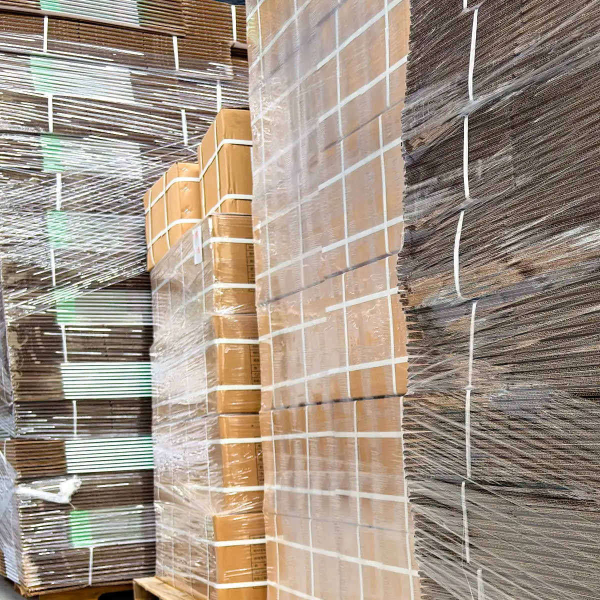 china-oem-valve-fittings-custom-packaging-logistics 9 Close-up of mass-produced custom packaging boxes for China-manufactured plastic valves and fittings stacked in the warehouse, supporting Private Label retail-ready packaging needs for overseas distributors.